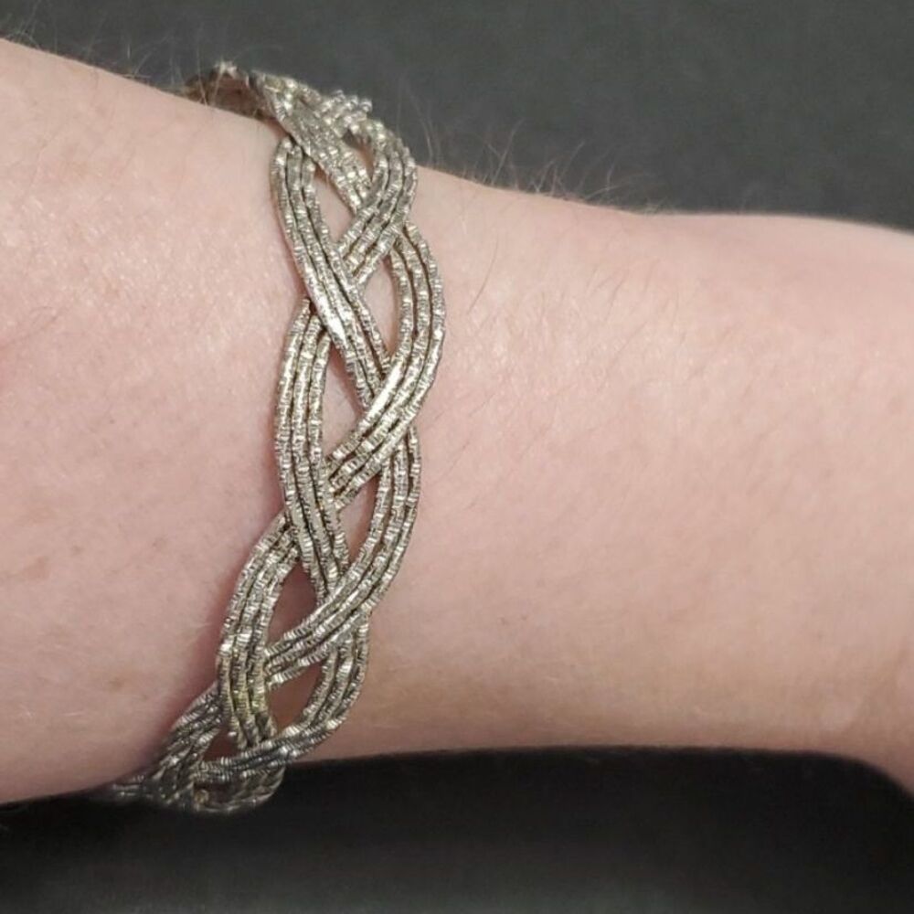 Silver tone braided bangle bracelet 7.75"